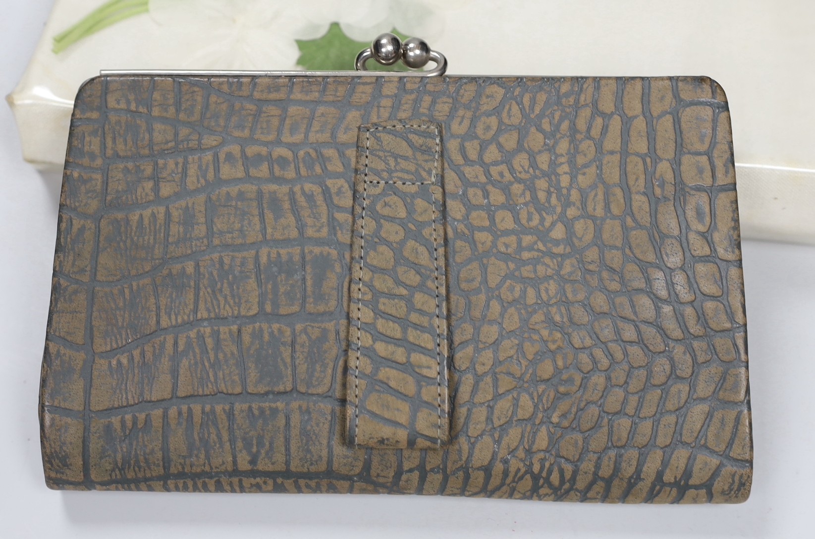 Two 1960's gilt metal ladies evening bags, a metal and wooden bag, a 1950's plastic and fabric bag possibly American, a 1930's faux crocodile clutch bag and a 1930's stripe clutch bag